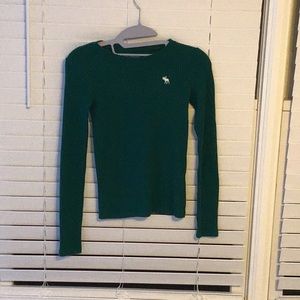 Green long sleeve top.